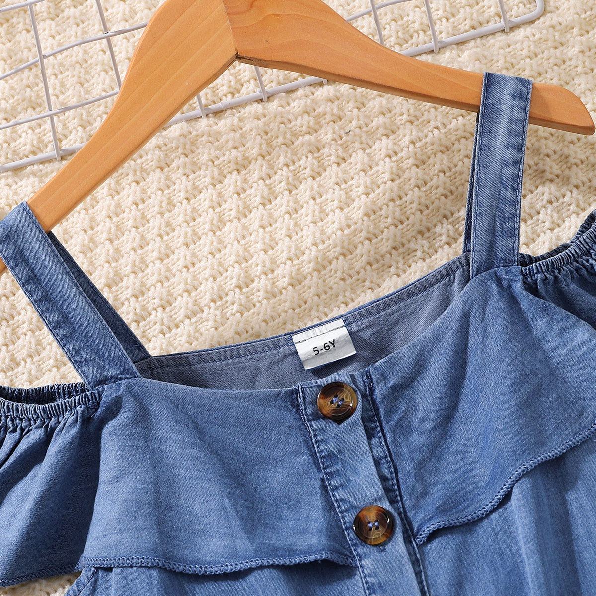 Girls Cold-Shoulder Buttoned Denim Dress featuring a square neckline and pockets, made from soft lyocell fabric.