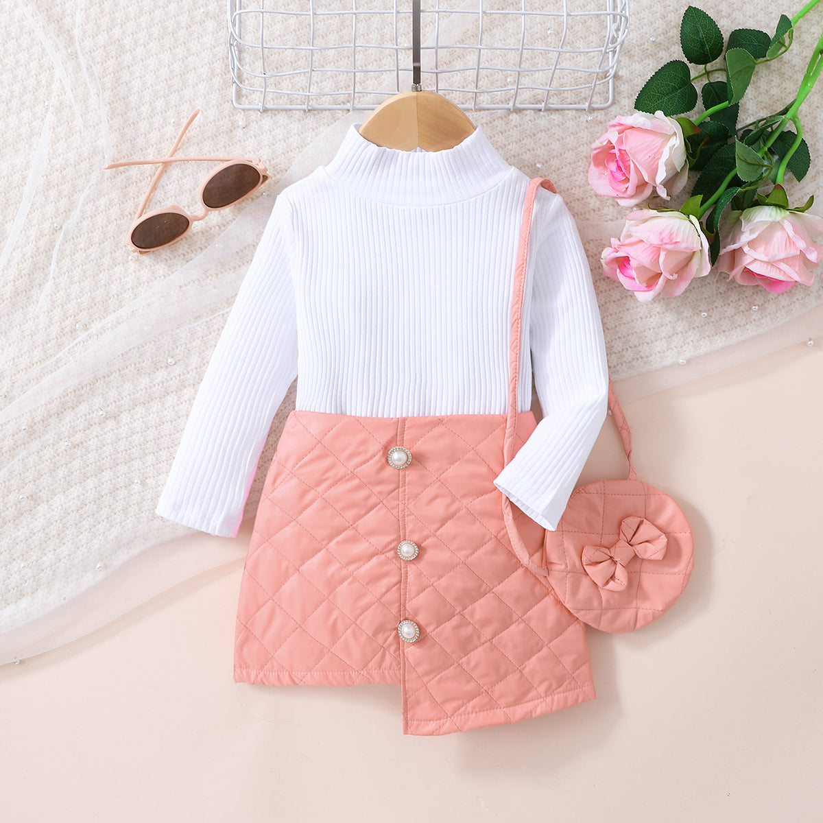 Girls Knit Top and Decorative Button Skirt Set with matching bag, featuring a mock neck and decorative buttons.