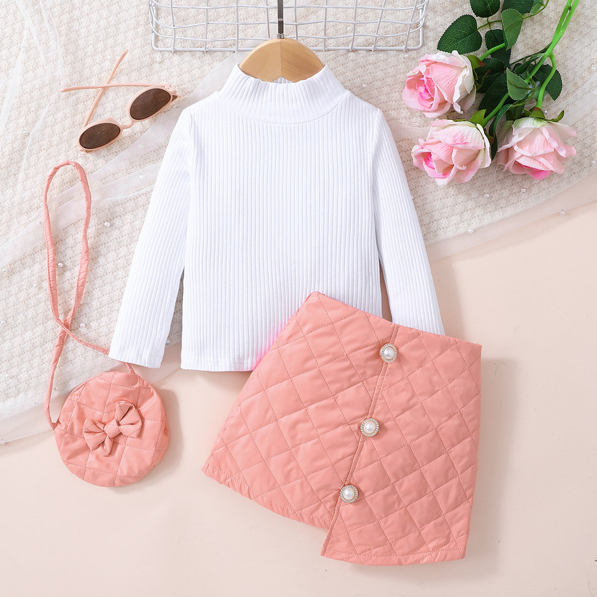 Girls Knit Top and Decorative Button Skirt Set with matching bag, featuring a mock neck and decorative buttons.