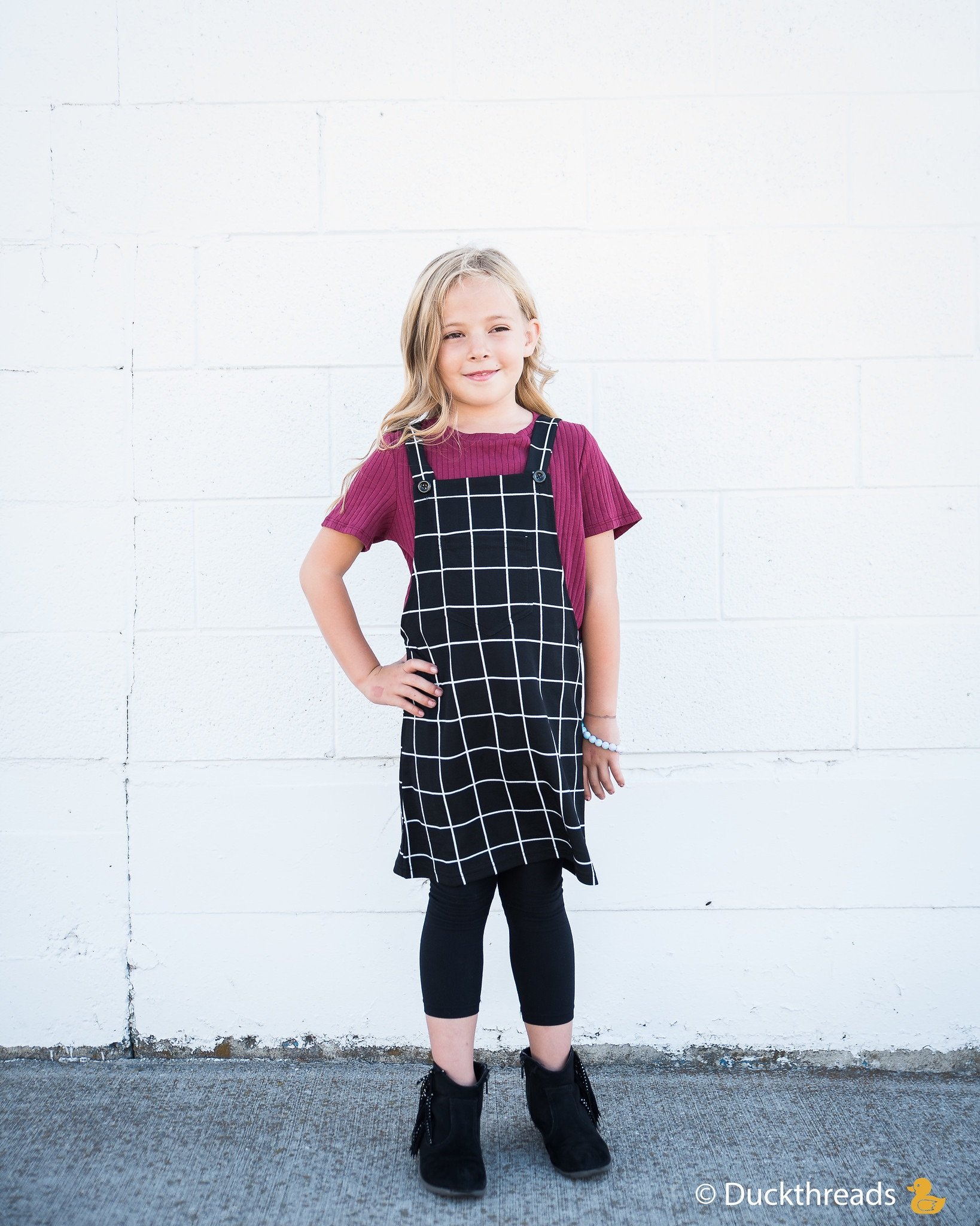 Girls Ribbed Tie Bottom Tee in Pink and Burgundy, showcasing soft ribbed fabric and stylish tie bottom design.