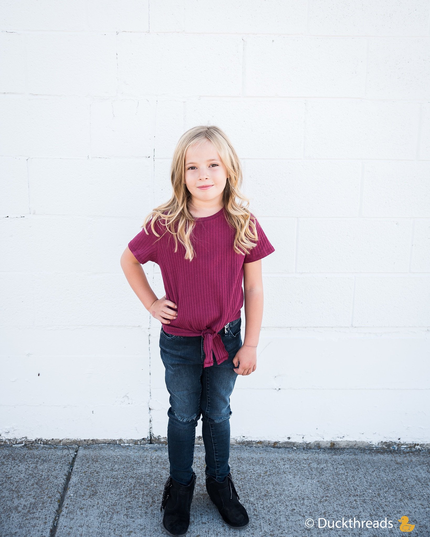 Girls Ribbed Tie Bottom Tee in Pink and Burgundy, showcasing soft ribbed fabric and stylish tie bottom design.