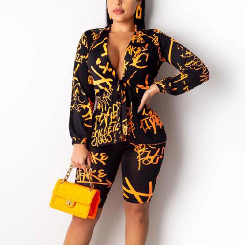 Glamaker Deep V Neck Short Jumpsuit Romper in vibrant neon print, featuring a lace-up design, perfect for clubbing and summer outings.