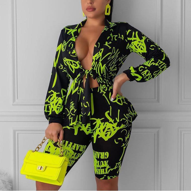 Glamaker Deep V Neck Short Jumpsuit Romper in vibrant neon print, featuring a lace-up design, perfect for clubbing and summer outings.