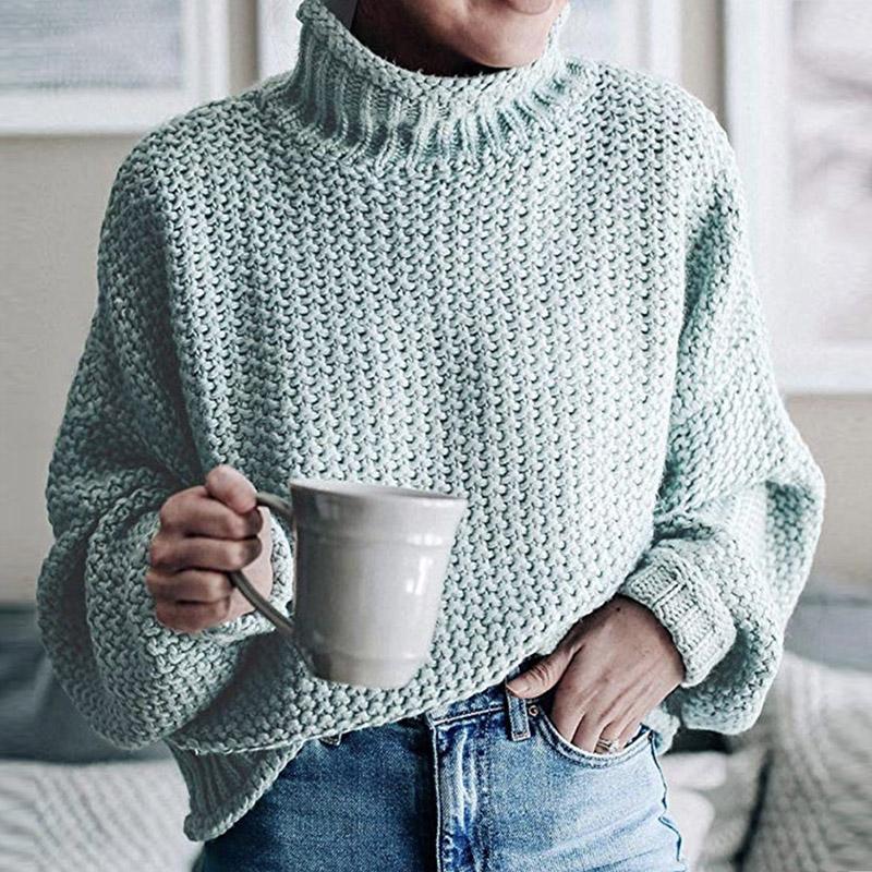 Glamaker Knitted Turtleneck Sweater featuring long lantern sleeves in a solid color, showcasing a stylish high street design.