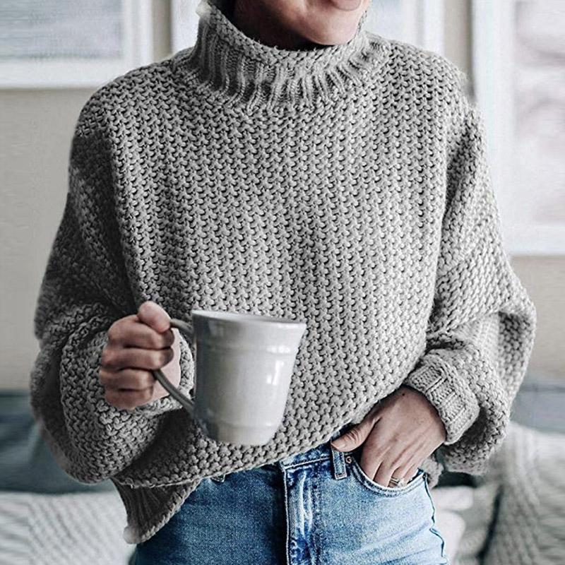 Glamaker Knitted Turtleneck Sweater featuring long lantern sleeves in a solid color, showcasing a stylish high street design.