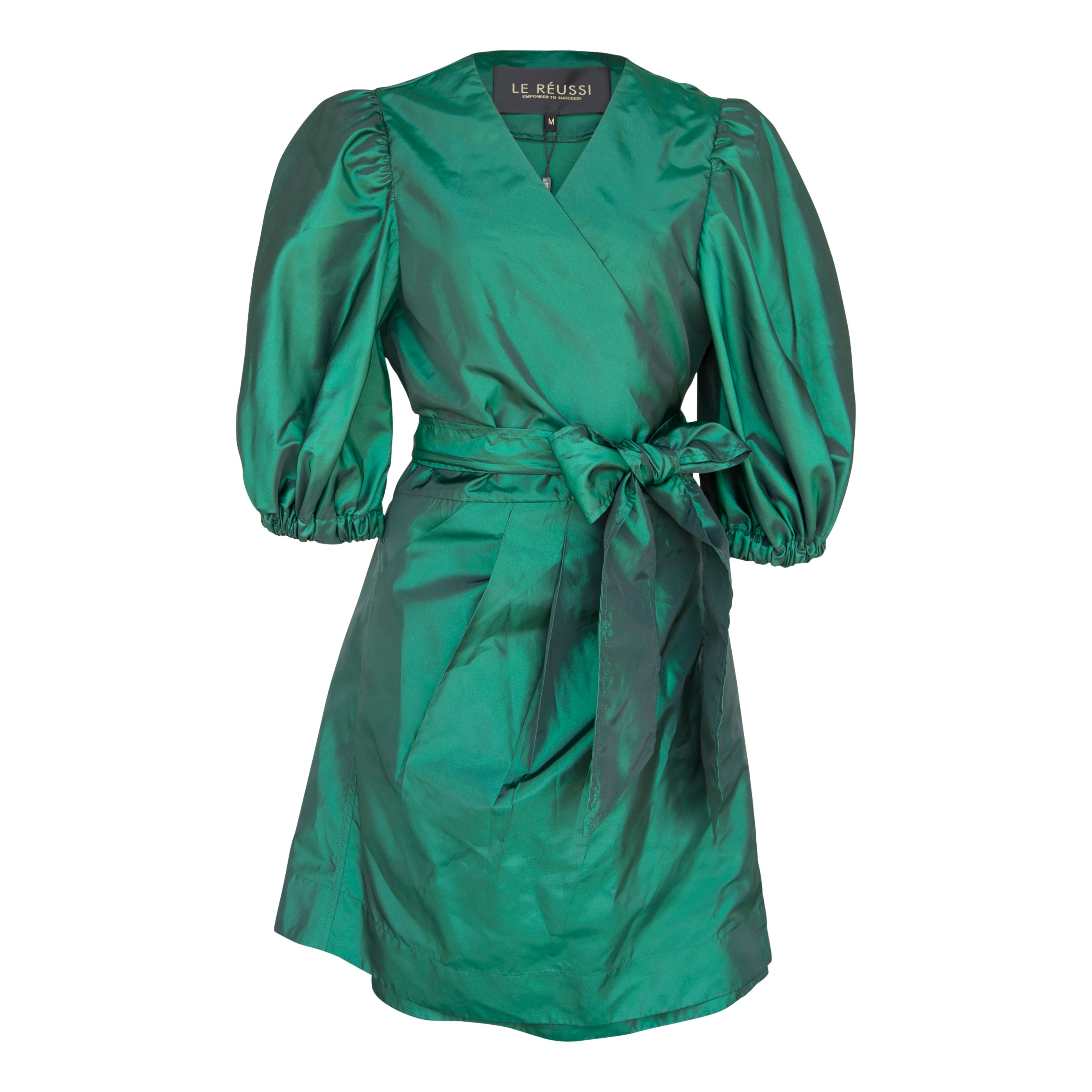 A luxurious green wrap dress from Le Réussi, showcasing its elegant design and plush fabric, perfect for work or cocktail events.