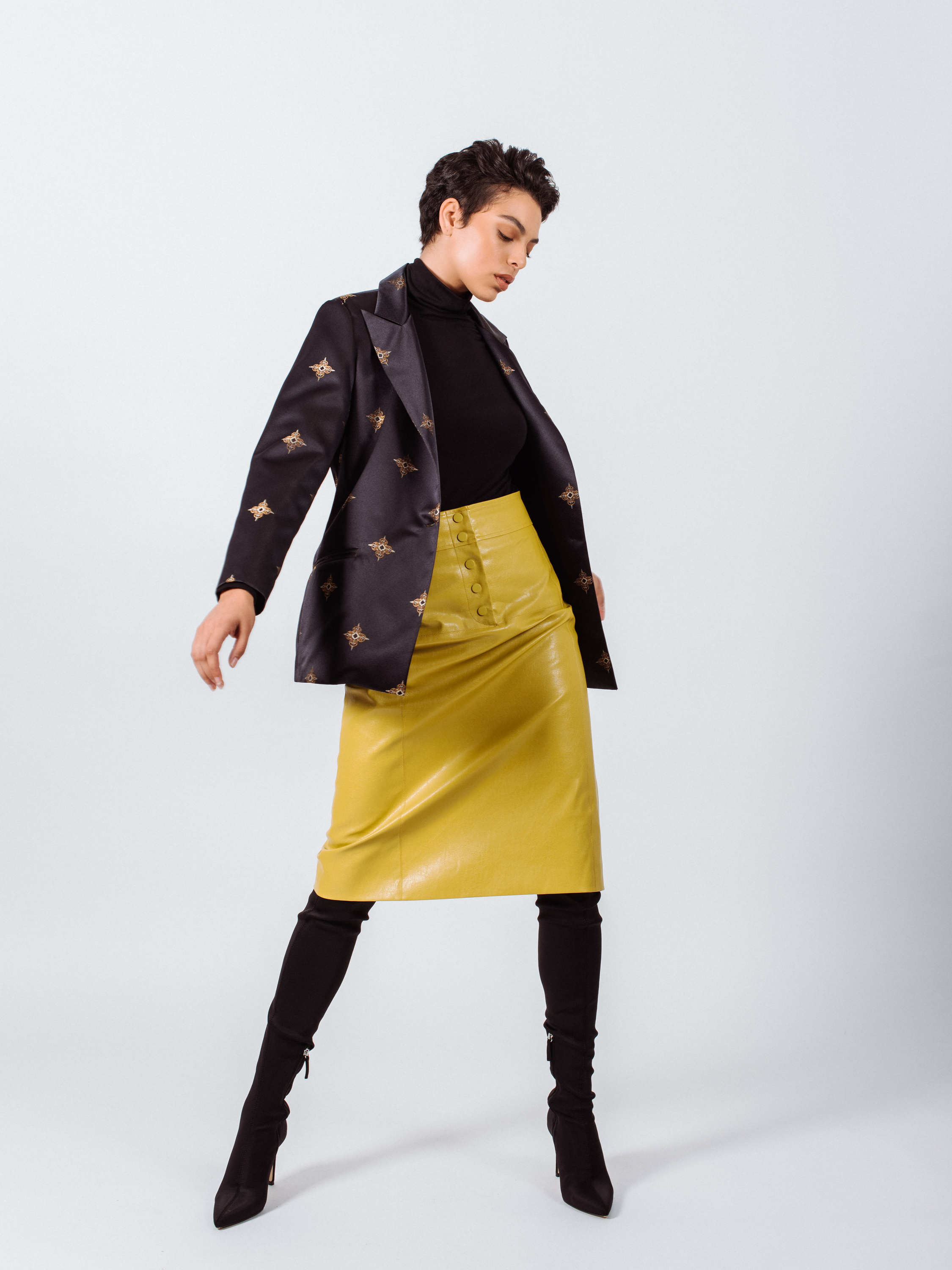 Glossy Vegan Leather Pencil Skirt in mustard color, featuring a stylish front-panel detail and front button fastening.