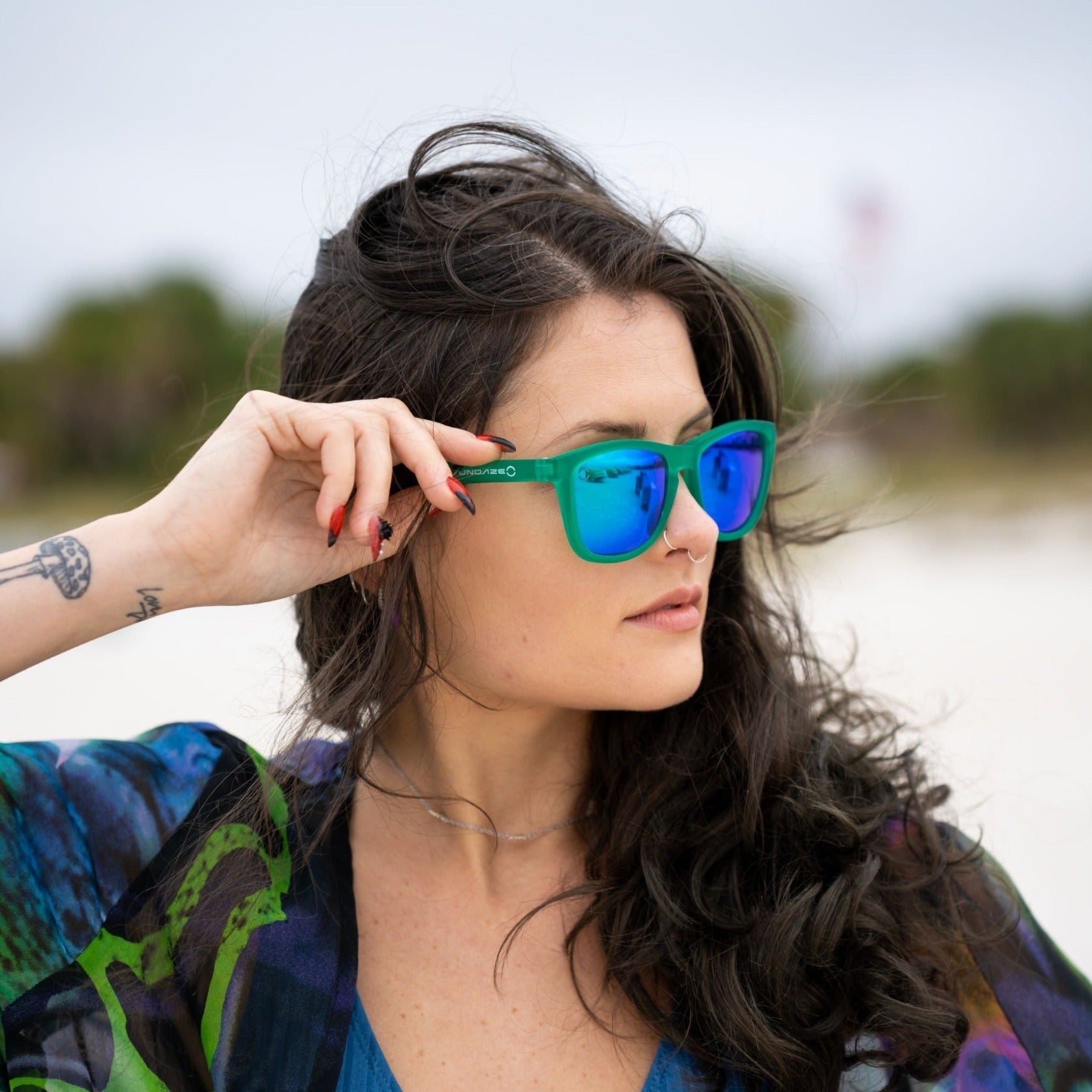 GNTEEZ sunglasses featuring polarized blue revo lenses and a rubber green BPA-free plastic frame, designed for comfort and style.