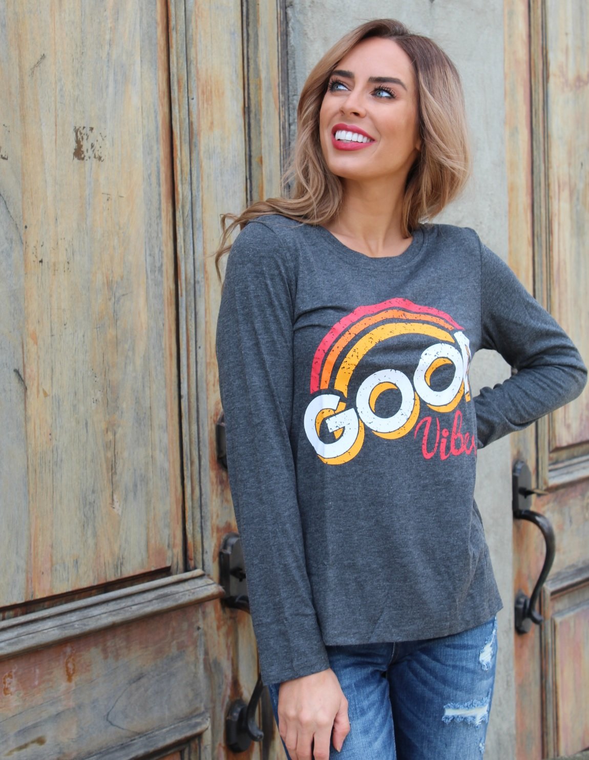 Good Vibes Long Sleeve T-Shirt featuring a vintage-inspired faded graphic design, made from soft cotton and polyester blend.