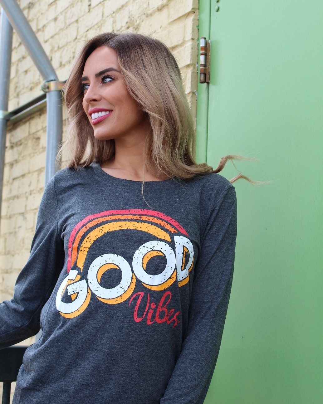 Good Vibes Long Sleeve T-Shirt featuring a vintage-inspired faded graphic design, made from soft cotton and polyester blend.