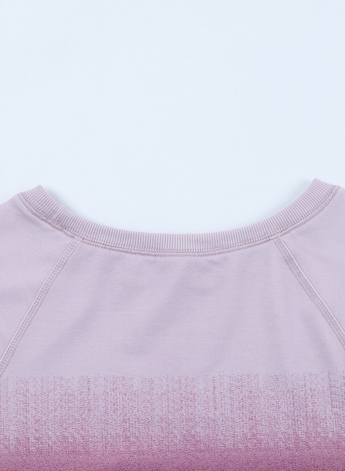 Gradient Raglan Sleeve Round Neck Sweatshirt displayed in a flat lay style, showcasing its unique gradient pattern and casual design.