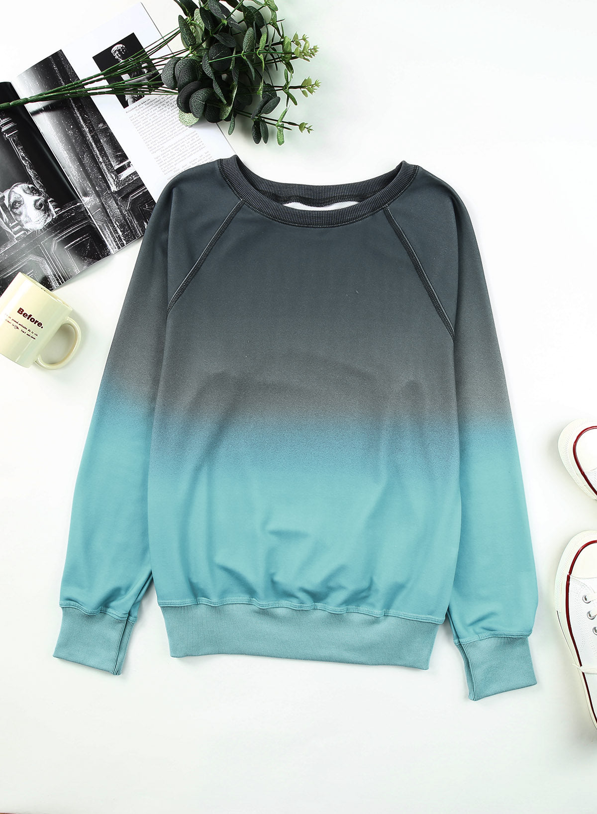 Gradient Raglan Sleeve Round Neck Sweatshirt displayed in a flat lay style, showcasing its unique gradient pattern and casual design.