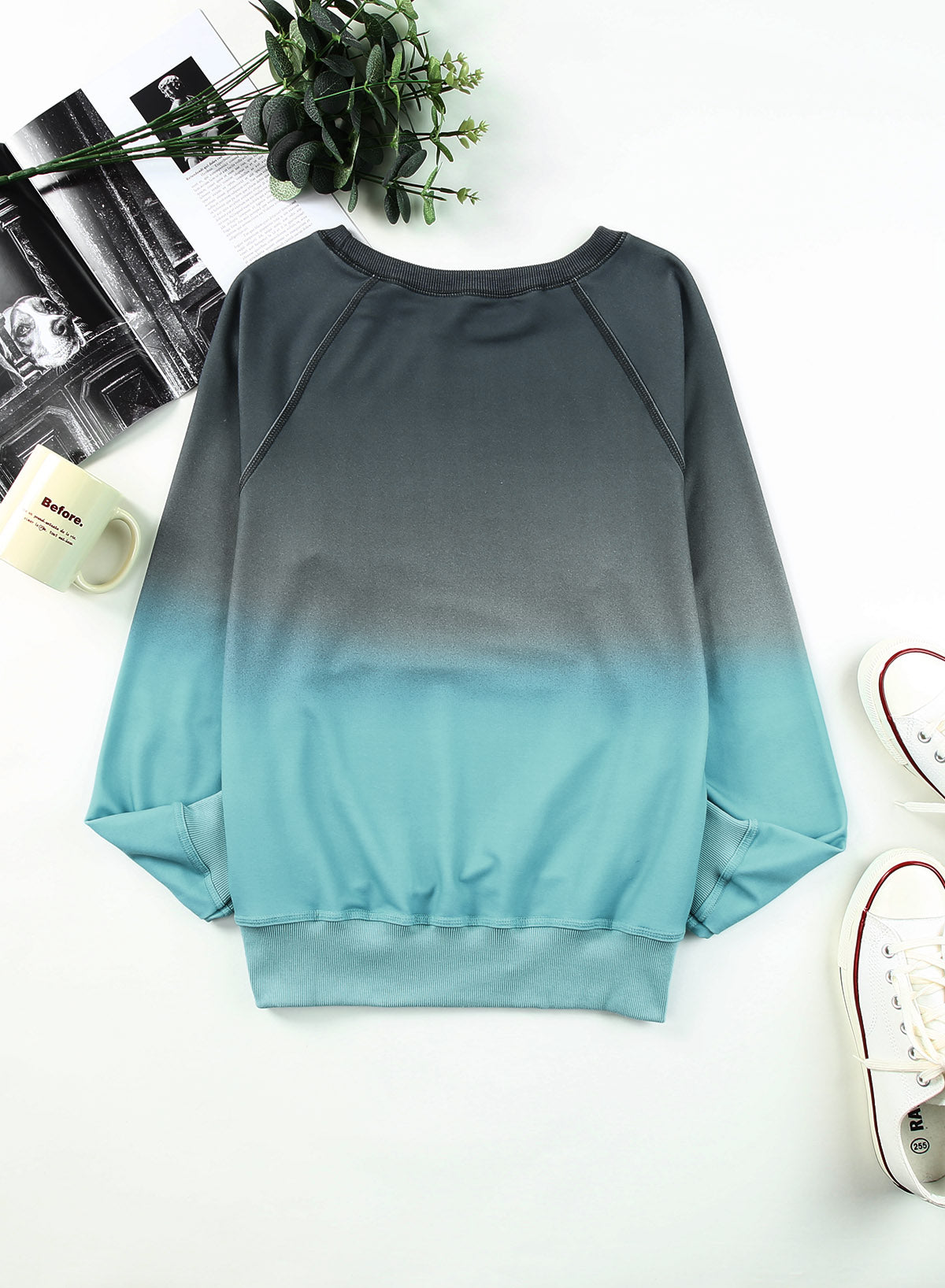 Gradient Raglan Sleeve Round Neck Sweatshirt displayed in a flat lay style, showcasing its unique gradient pattern and casual design.