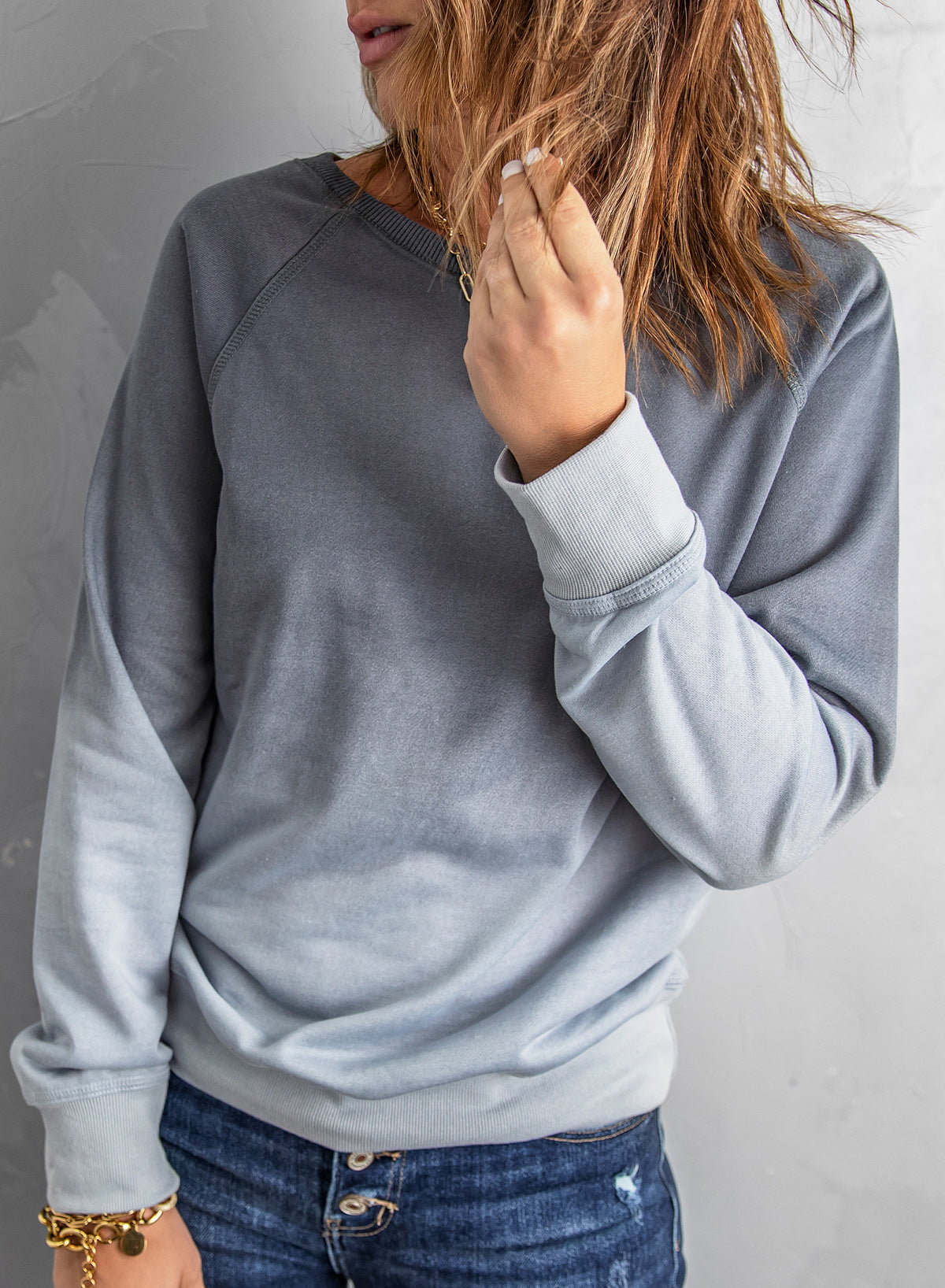 Gradient Raglan Sleeve Round Neck Sweatshirt displayed in a flat lay style, showcasing its unique gradient pattern and casual design.