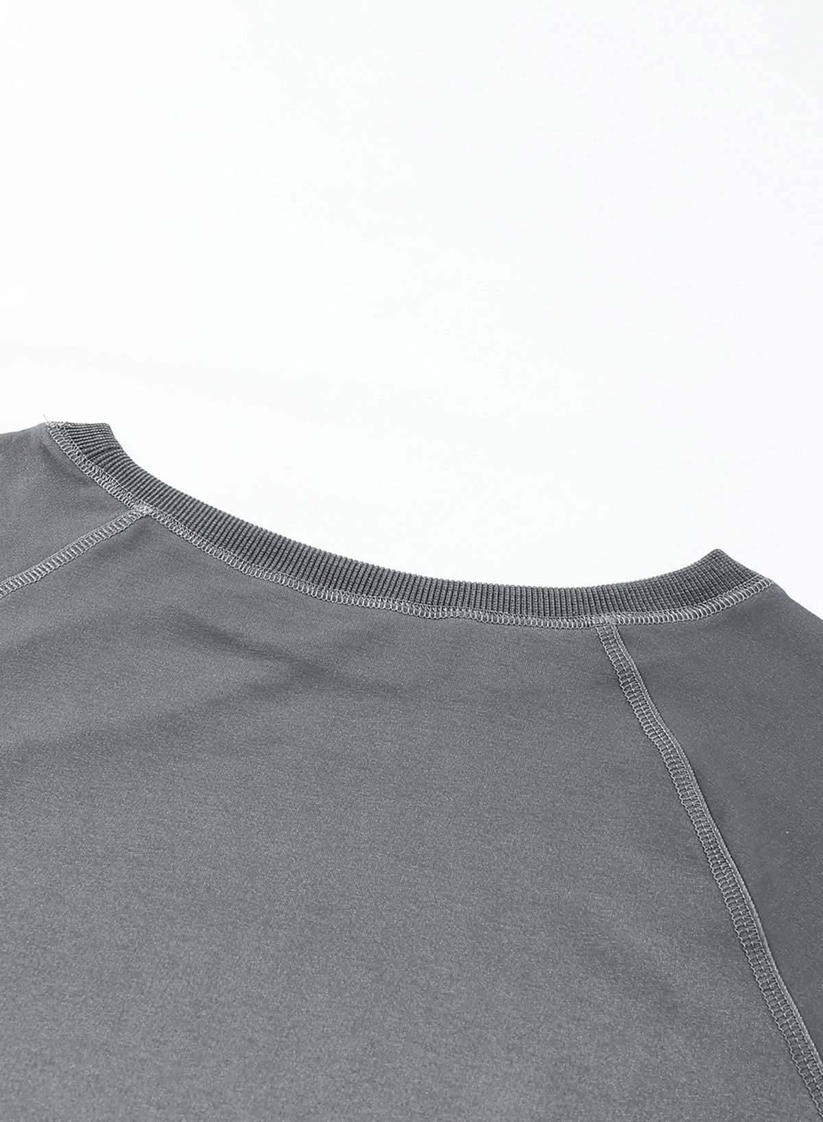 Gradient Raglan Sleeve Round Neck Sweatshirt displayed in a flat lay style, showcasing its unique gradient pattern and casual design.