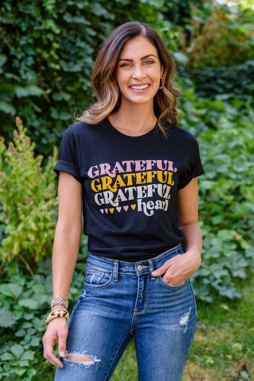 Grateful Heart Graphic T-Shirt in Black featuring a crew neckline and short sleeves, showcasing a cute graphic design.