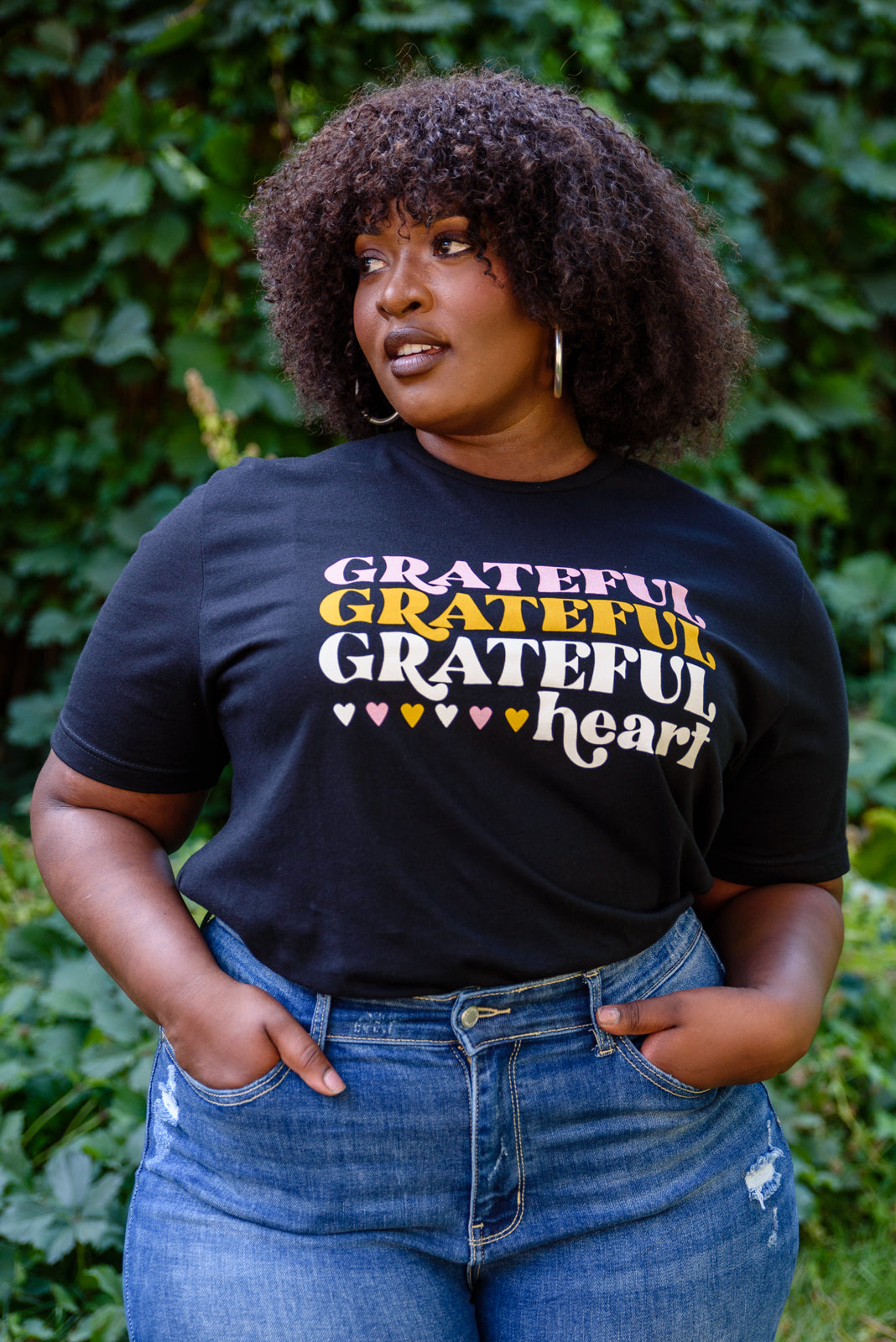 Grateful Heart Graphic T-Shirt in Black featuring a crew neckline and short sleeves, showcasing a cute graphic design.