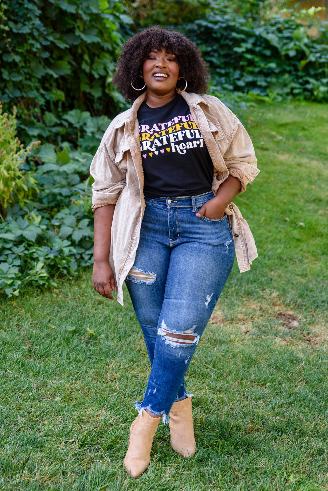 Grateful Heart Graphic T-Shirt in Black featuring a crew neckline and short sleeves, showcasing a cute graphic design.