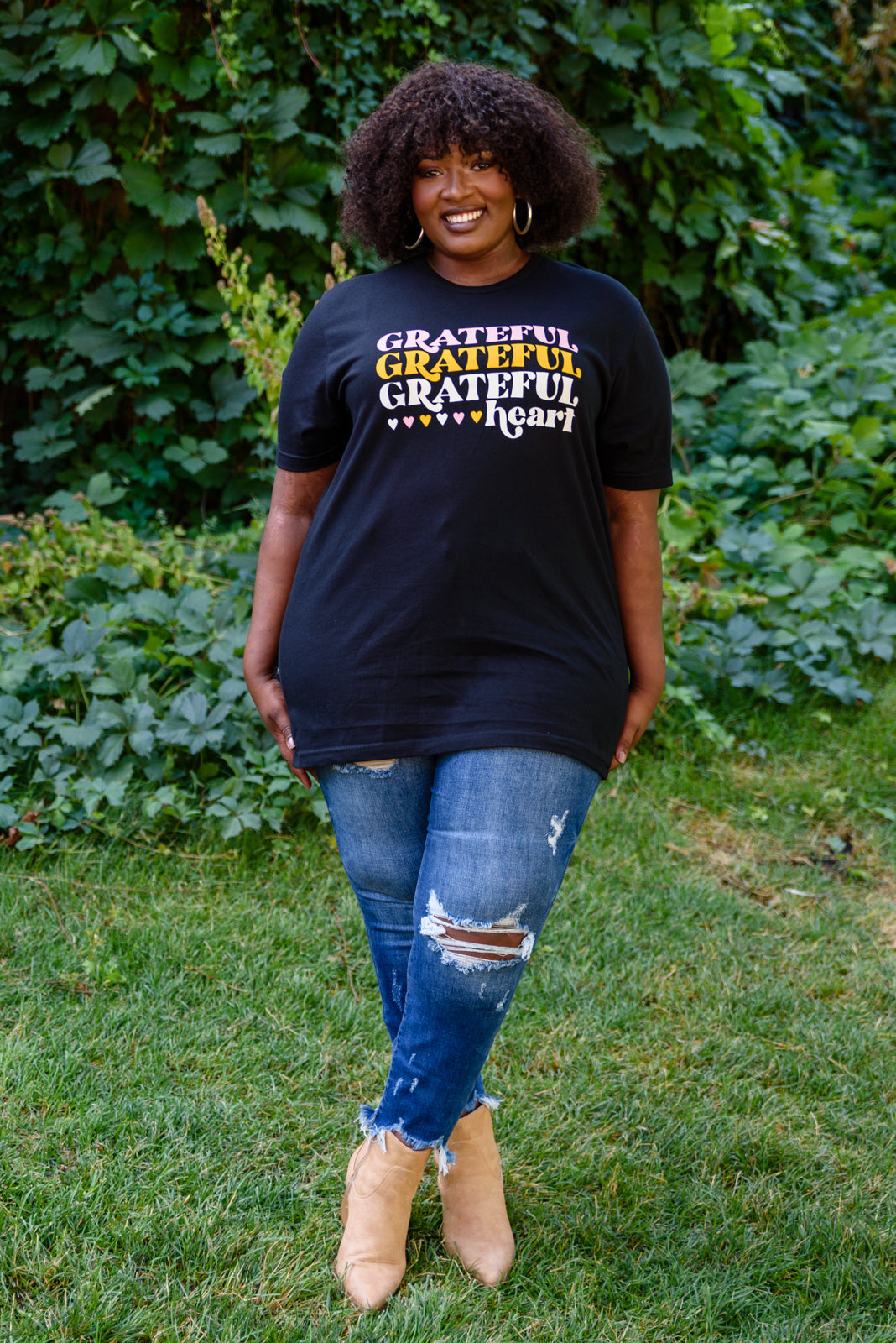 Grateful Heart Graphic T-Shirt in Black featuring a crew neckline and short sleeves, showcasing a cute graphic design.