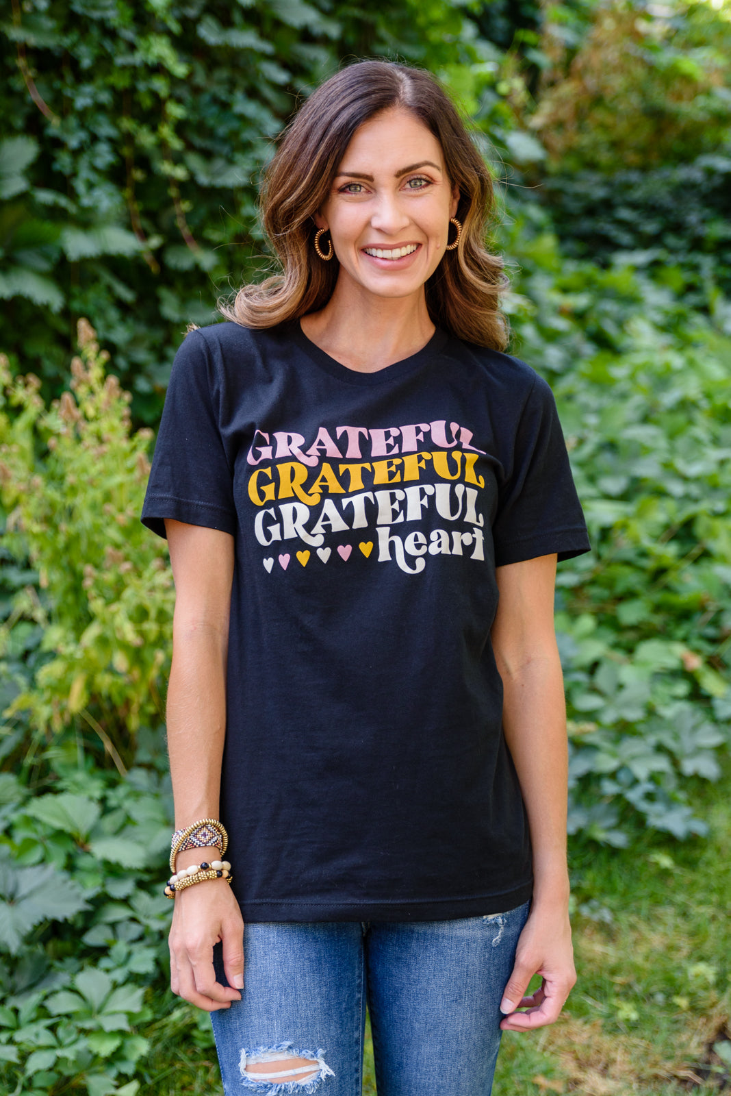 Grateful Heart Graphic T-Shirt in Black featuring a crew neckline and short sleeves, showcasing a cute graphic design.