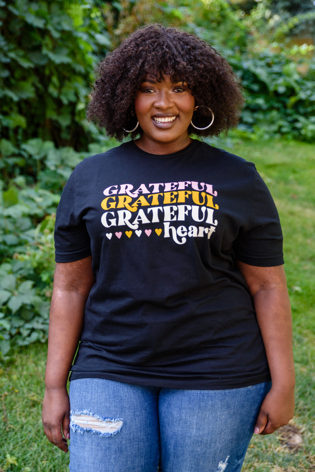 Grateful Heart Graphic T-Shirt in Black featuring a crew neckline and short sleeves, showcasing a cute graphic design.