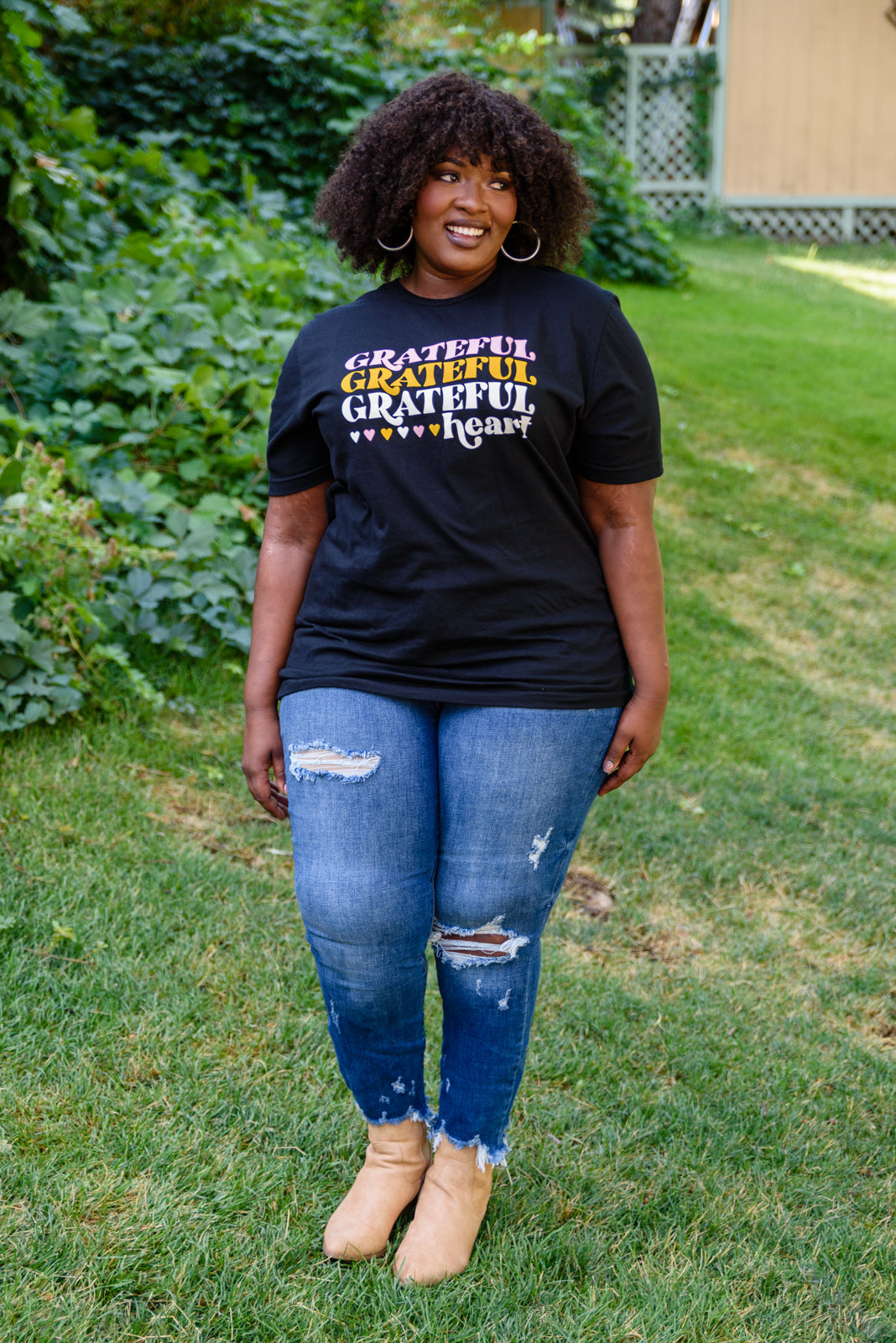 Grateful Heart Graphic T-Shirt in Black featuring a crew neckline and short sleeves, showcasing a cute graphic design.