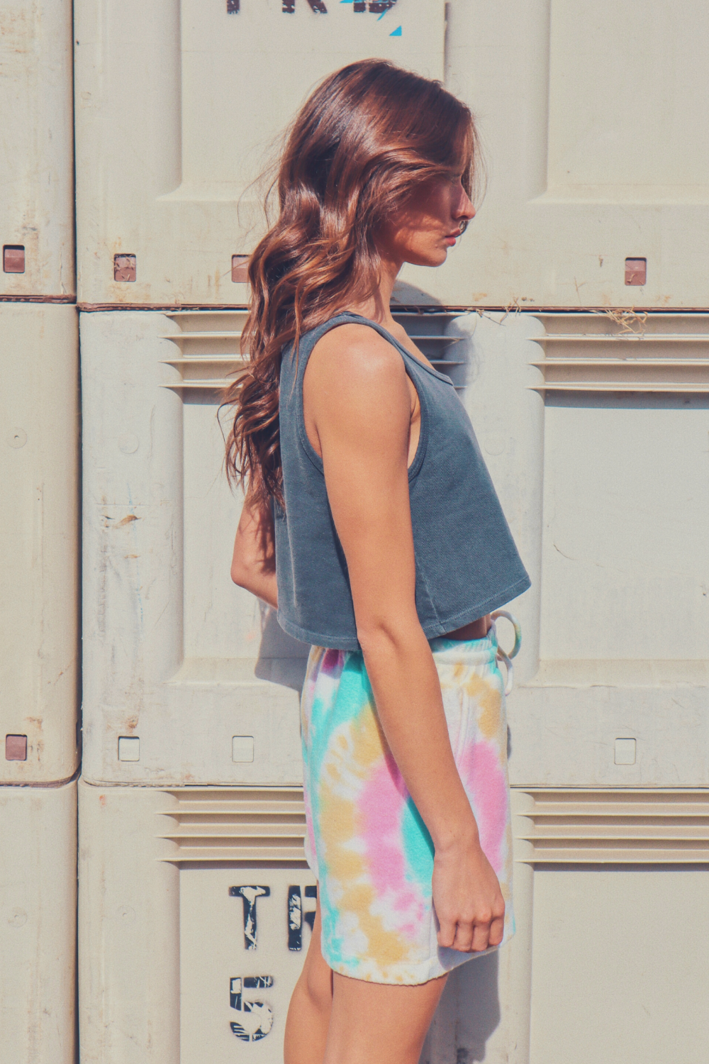 A pair of vibrant tie-dye shorts in Malibu and Miami colors, made from eco-friendly plush fleece fabric, featuring a drawstring waist and trouser pockets.