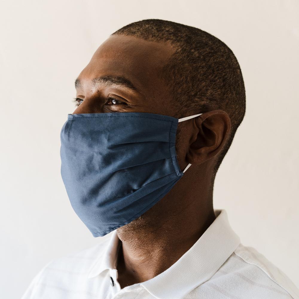 Gray Oxford Face Mask made from 100% cotton, featuring a pleated design for comfort and a pocket for filter insertion.