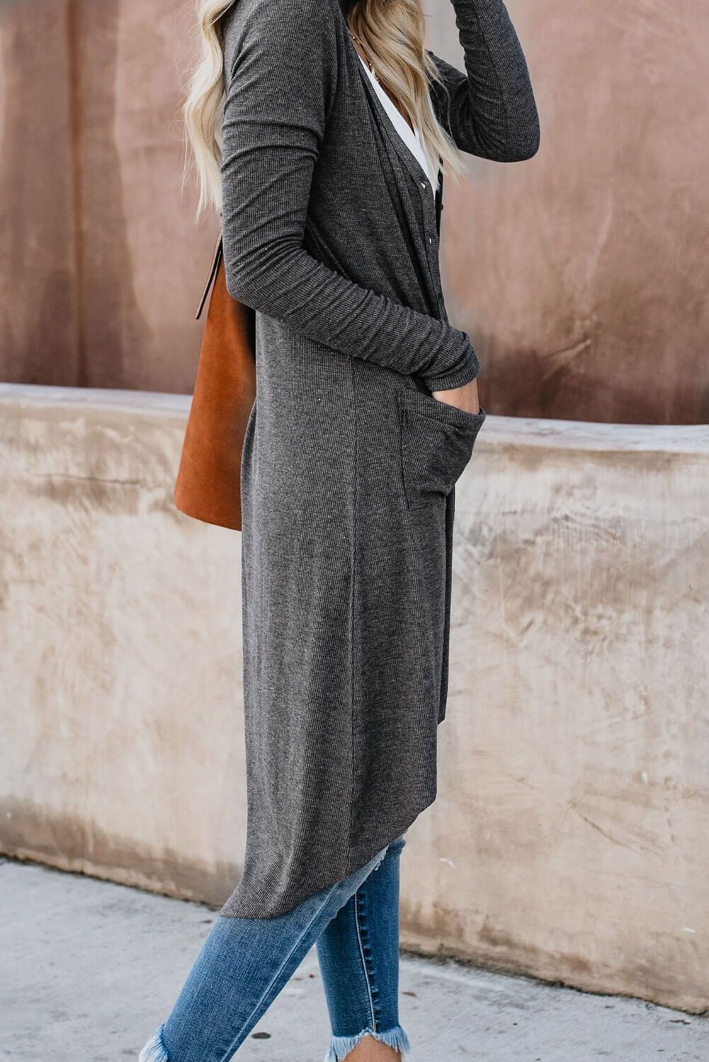 Gray long cardigan with button closure and side pockets, featuring a high low design, perfect for layering in any season.