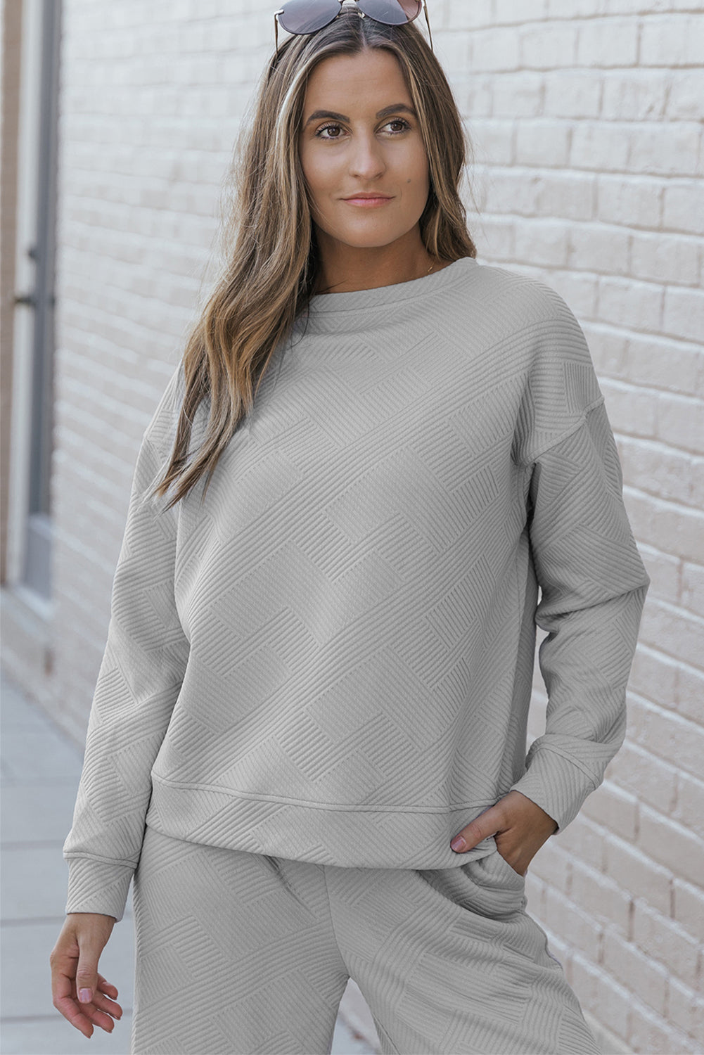 Gray ultra loose textured 2-piece slouchy outfit featuring a long-sleeved top and wide-leg pants with drawstrings, perfect for casual wear.