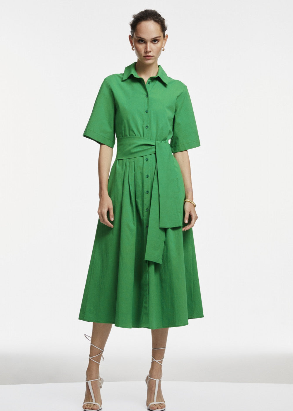 A stylish green midi shirt dress featuring a button-down design, perfect for various occasions.