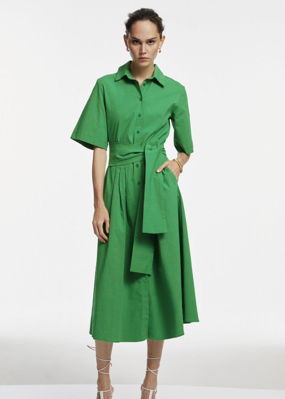 A stylish green midi shirt dress featuring a button-down design, perfect for various occasions.