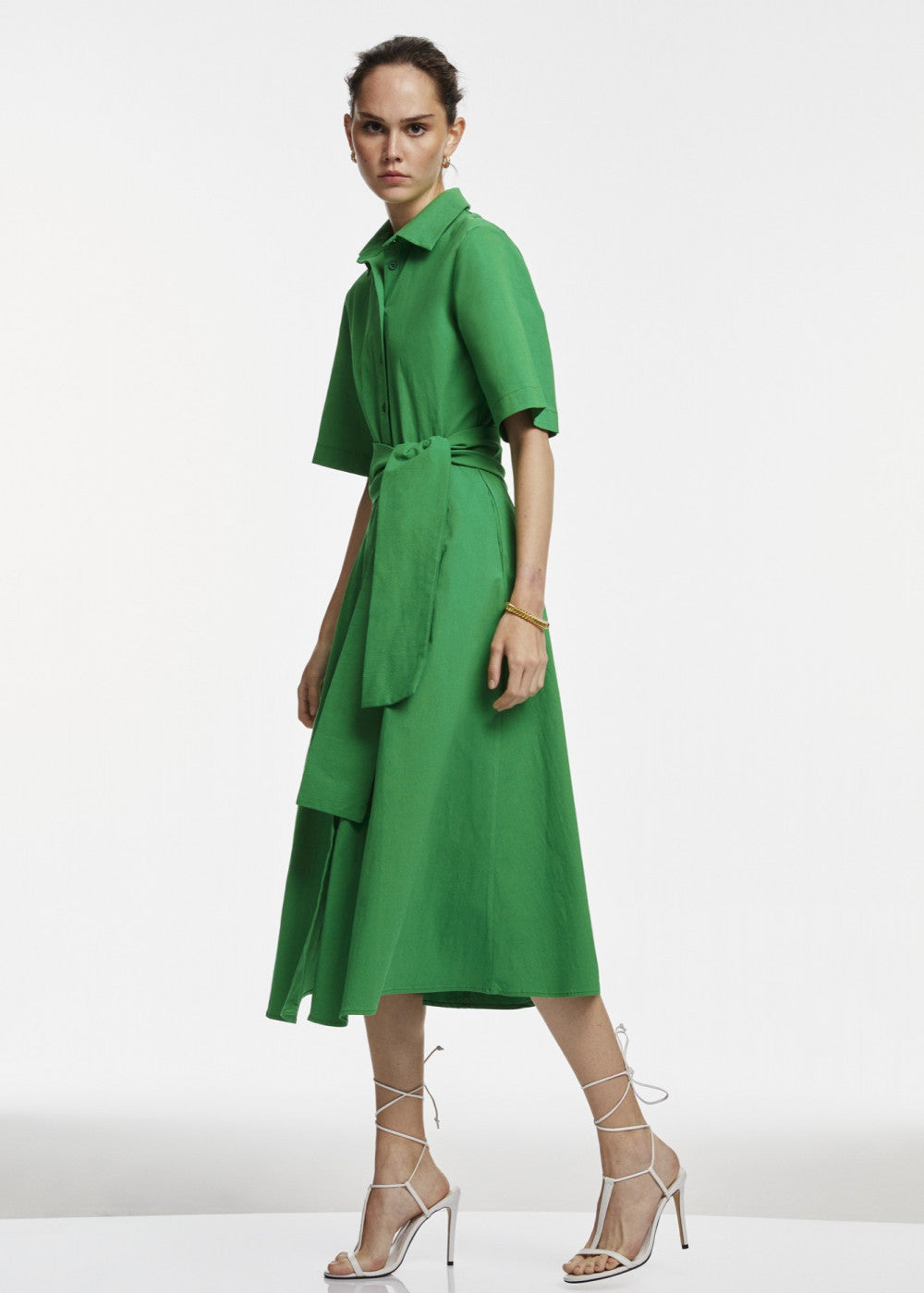 A stylish green midi shirt dress featuring a button-down design, perfect for various occasions.