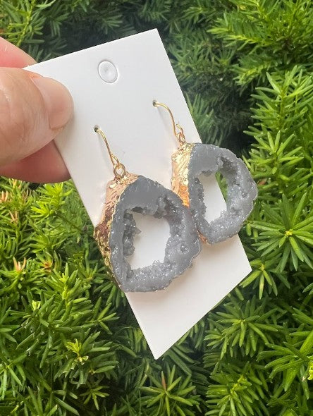 A pair of Grey Gray Agate Slice Resin Statement Earrings with gold sides, showcasing unique patterns and a stylish design.