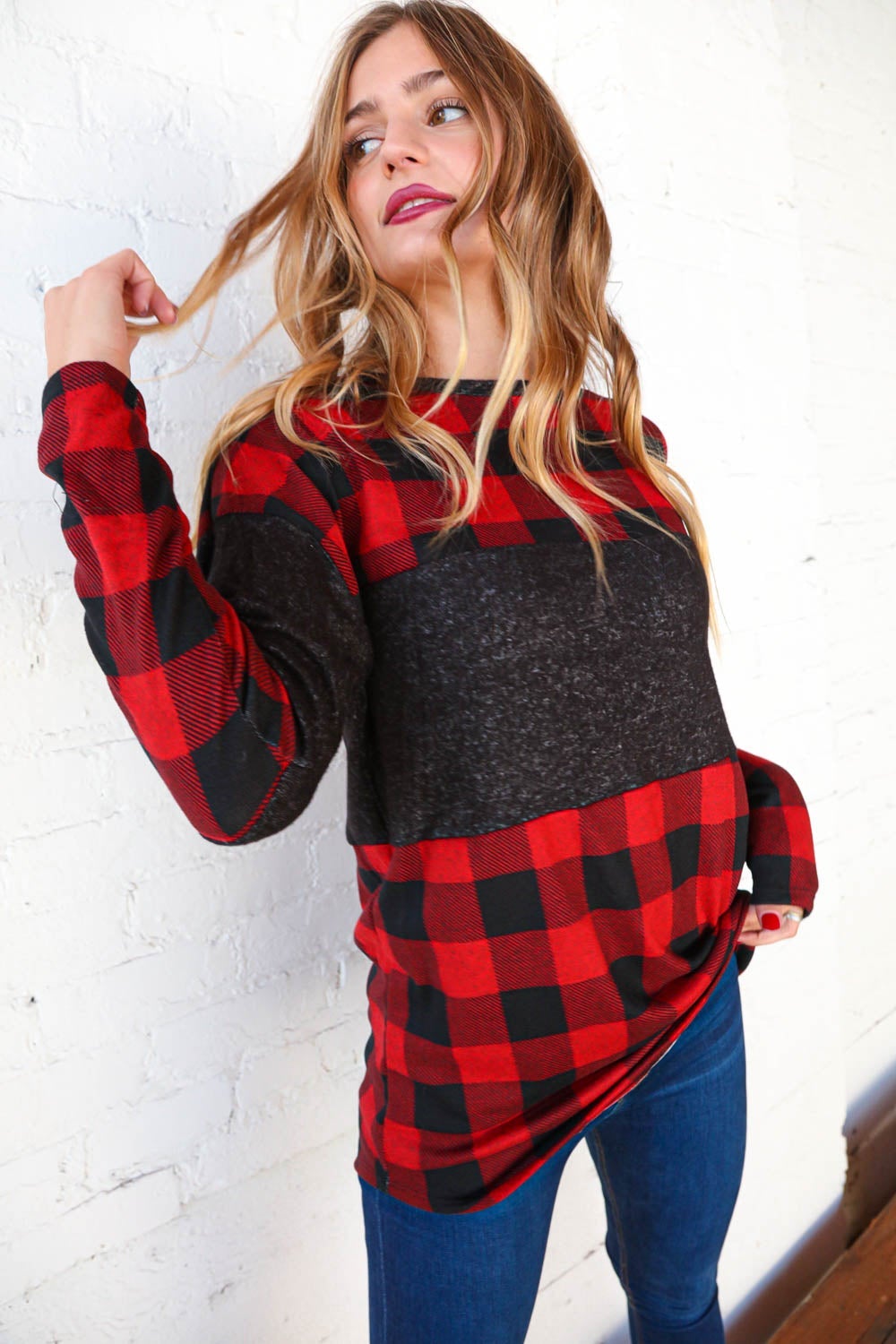 Hacci plaid and black color block pullover showcasing a stylish design with a cozy cashmere-like feel.