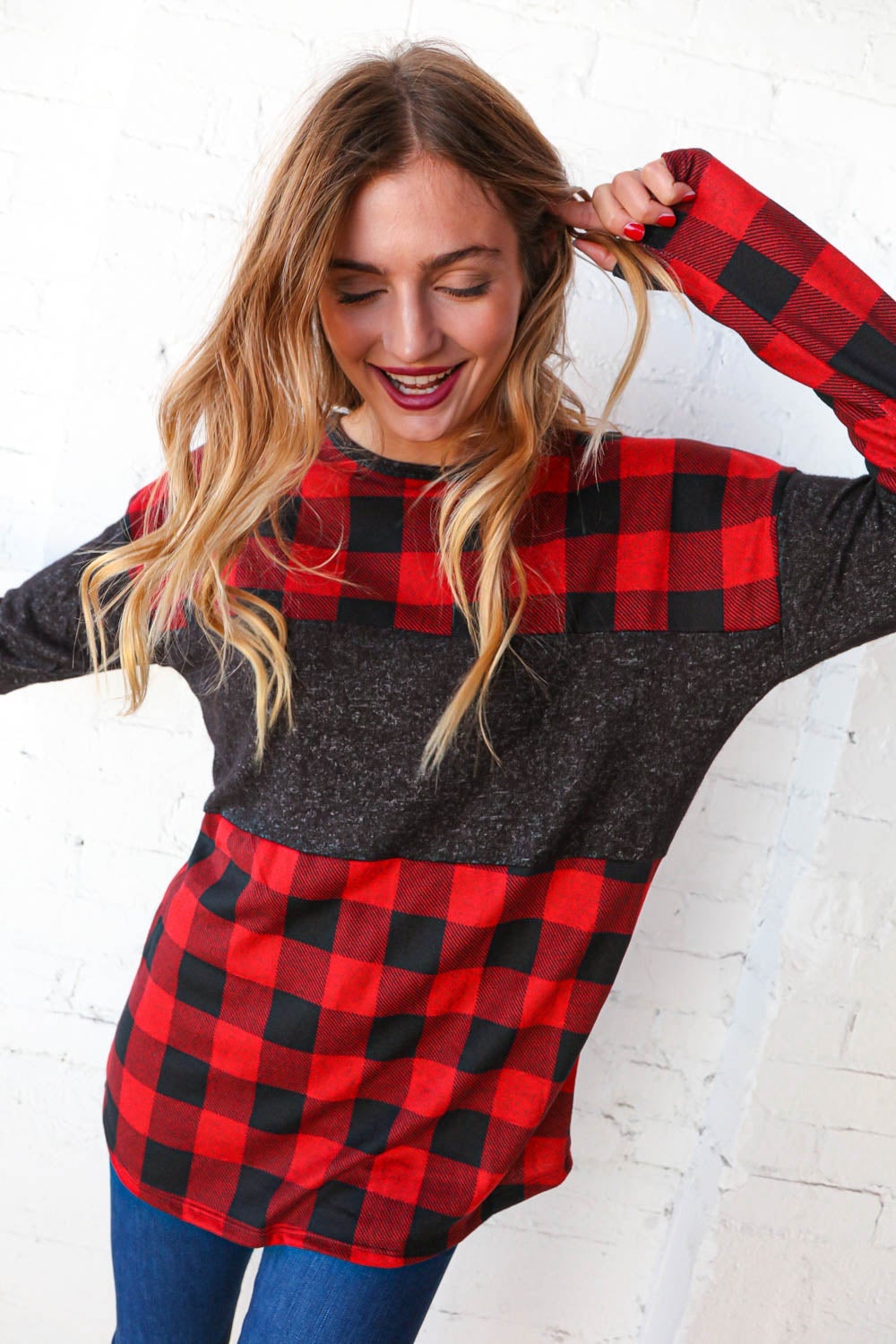 Hacci plaid and black color block pullover showcasing a stylish design with a cozy cashmere-like feel.