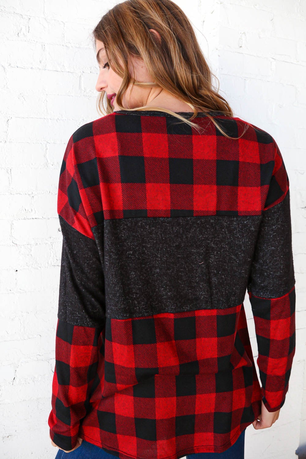 Hacci plaid and black color block pullover showcasing a stylish design with a cozy cashmere-like feel.