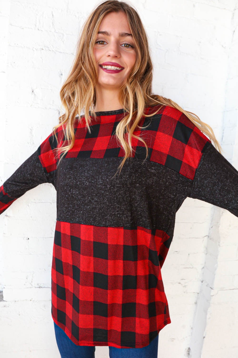 Hacci plaid and black color block pullover showcasing a stylish design with a cozy cashmere-like feel.