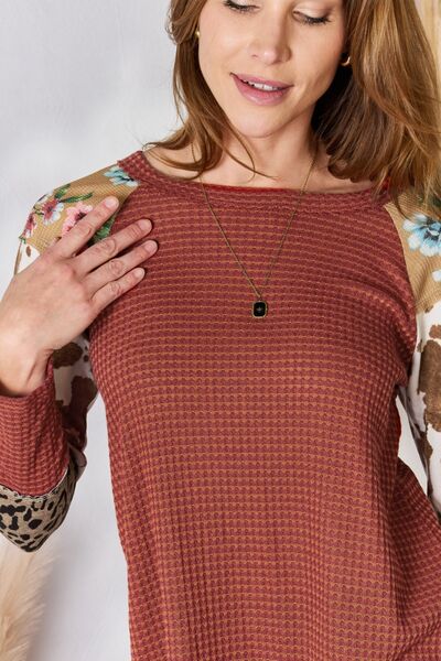 Hailey & Co Full Size Leopard Waffle-Knit Blouse featuring a trendy leopard print and cozy waffle-knit texture, perfect for stylish outfits.