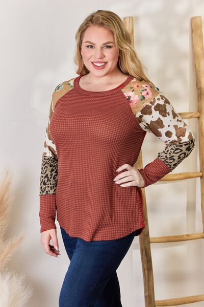 Hailey & Co Full Size Leopard Waffle-Knit Blouse featuring a trendy leopard print and cozy waffle-knit texture, perfect for stylish outfits.