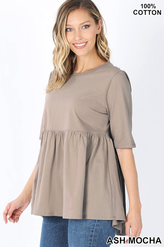 Half Sleeve Empire Waist Shirring Top in dusty teal with elegant ruffles and peplum design, showcasing its flattering silhouette.