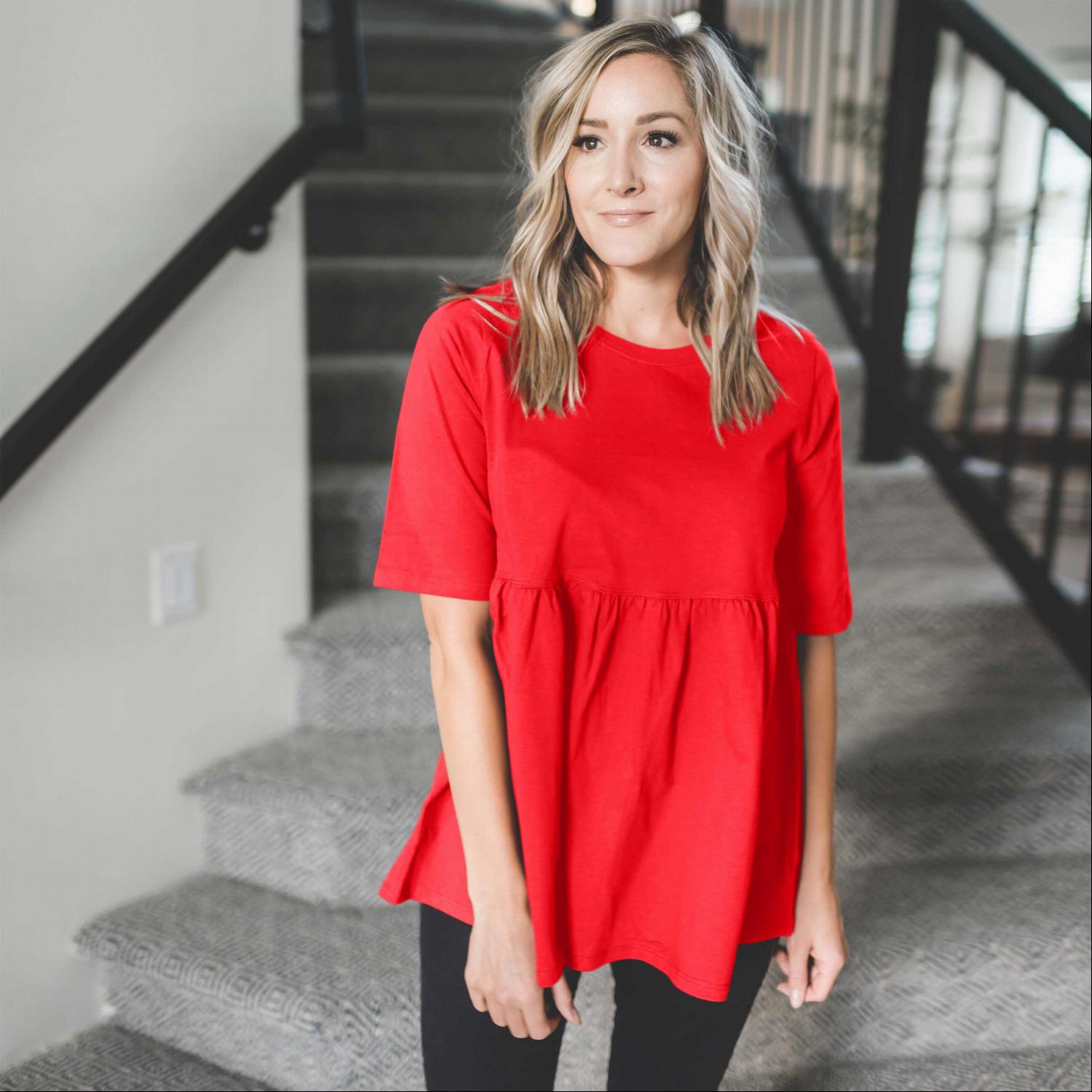 Half Sleeve Empire Waist Shirring Top in dusty teal with elegant ruffles and peplum design, showcasing its flattering silhouette.