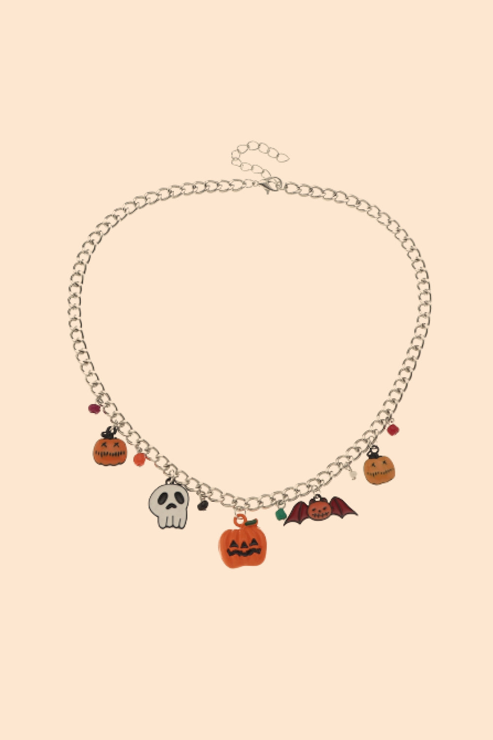 A Halloween charm bracelet and necklace set featuring pumpkin and ghost charms, made from alloy and resin, displayed on a festive background.