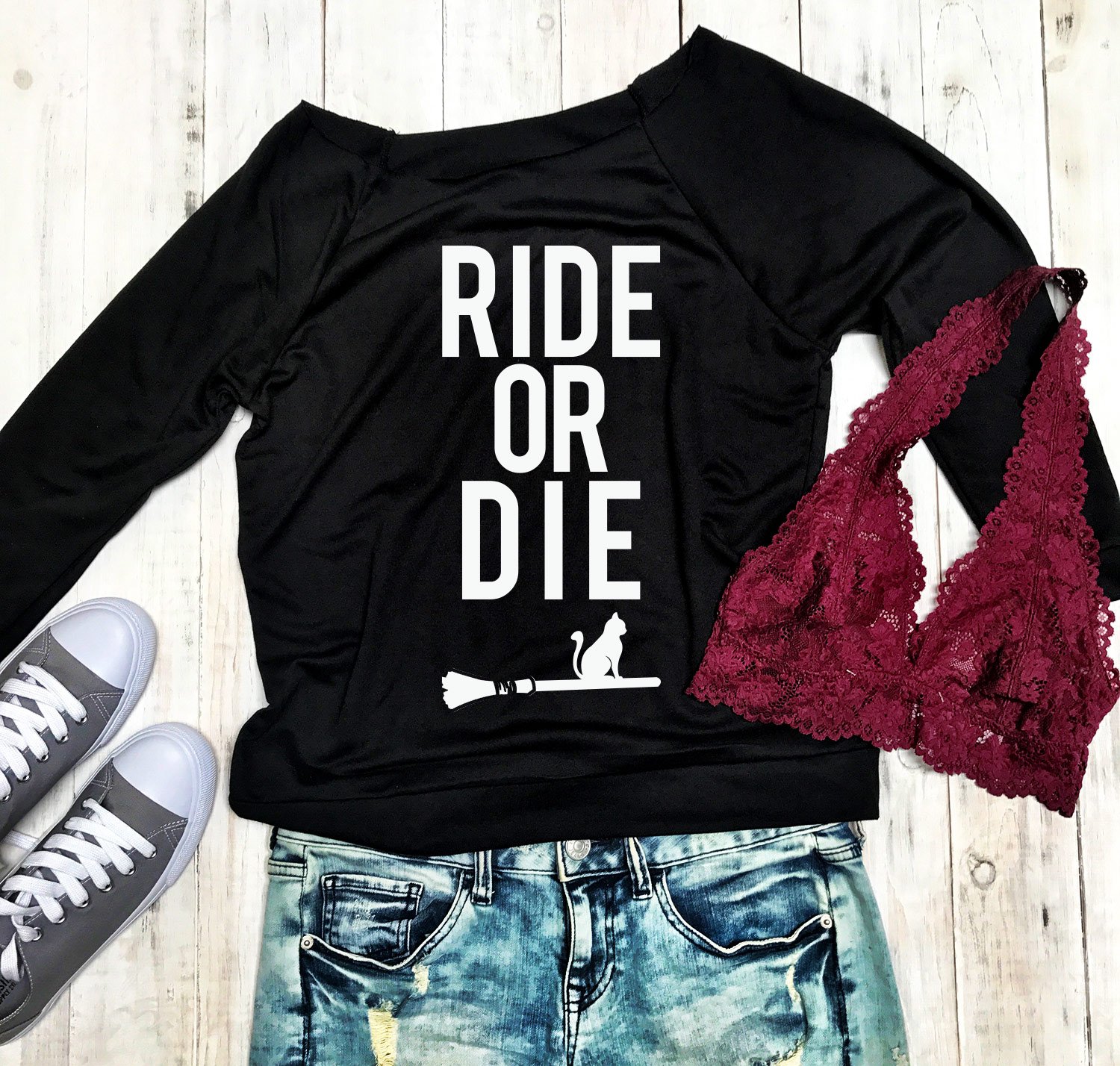 HALLOWEEN RIDE or DIE Long Sleeve Sweater in a slouchy style, featuring a playful Halloween design, available in various sizes.