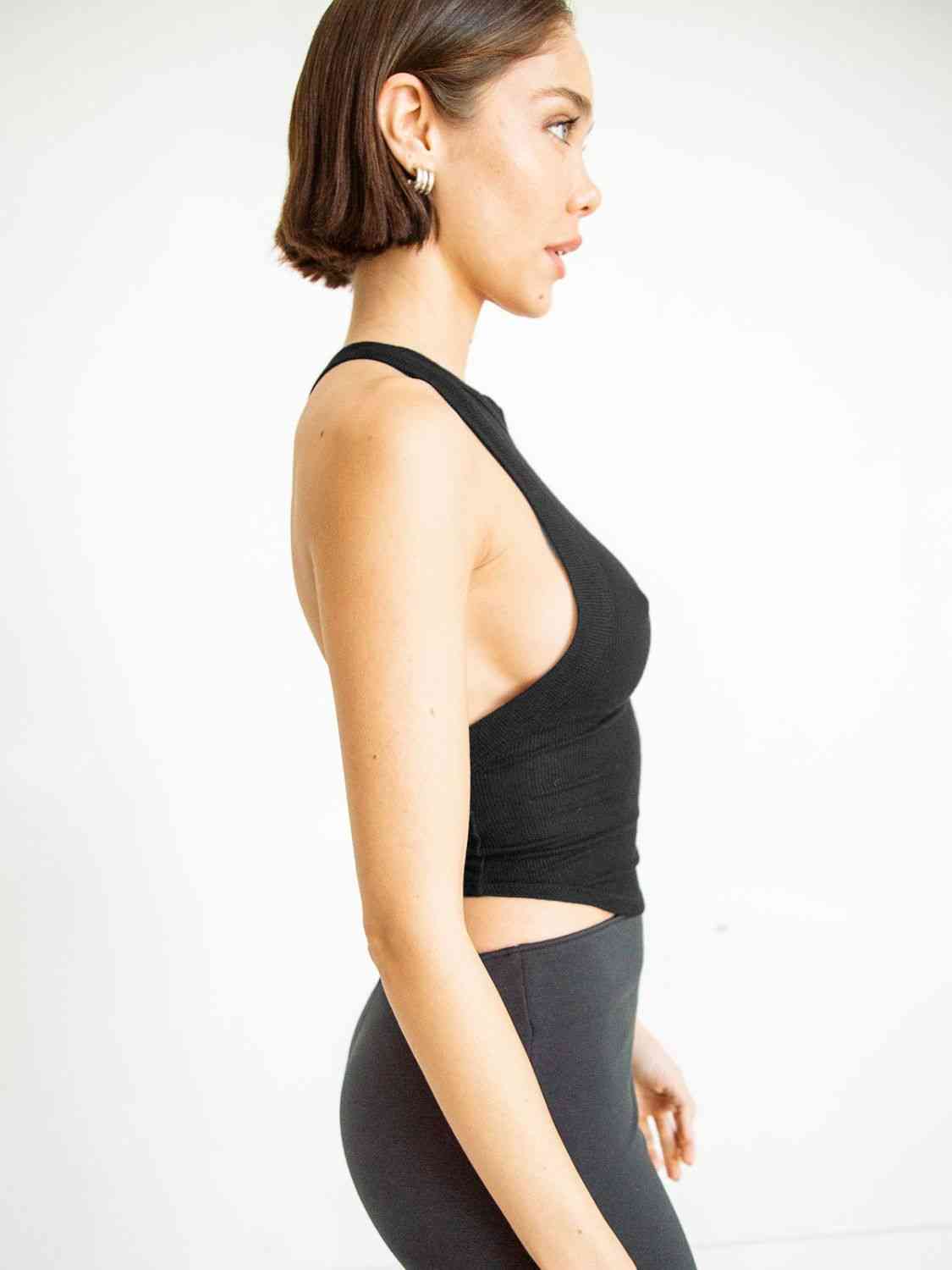 A stylish Halter Neck Ribbed Cropped Top in solid color, showcasing its backless design and sleeveless style, perfect for casual summer wear.