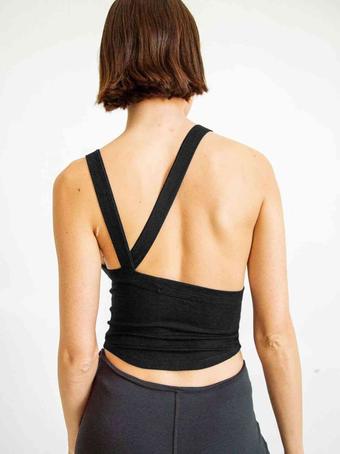 A stylish Halter Neck Ribbed Cropped Top in solid color, showcasing its backless design and sleeveless style, perfect for casual summer wear.