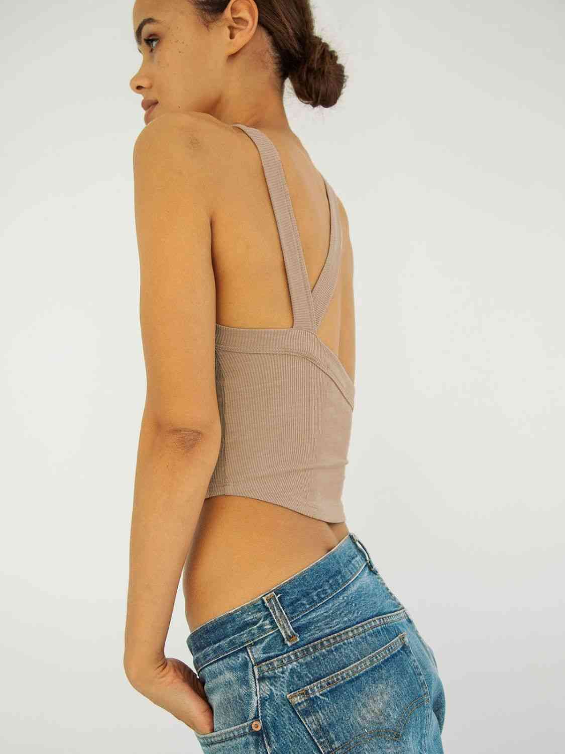 A stylish Halter Neck Ribbed Cropped Top in solid color, showcasing its backless design and sleeveless style, perfect for casual summer wear.