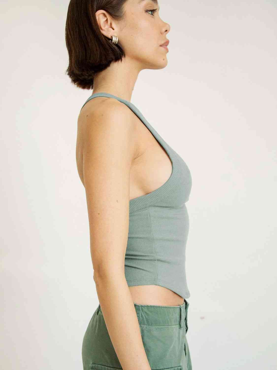 A stylish Halter Neck Ribbed Cropped Top in solid color, showcasing its backless design and sleeveless style, perfect for casual summer wear.