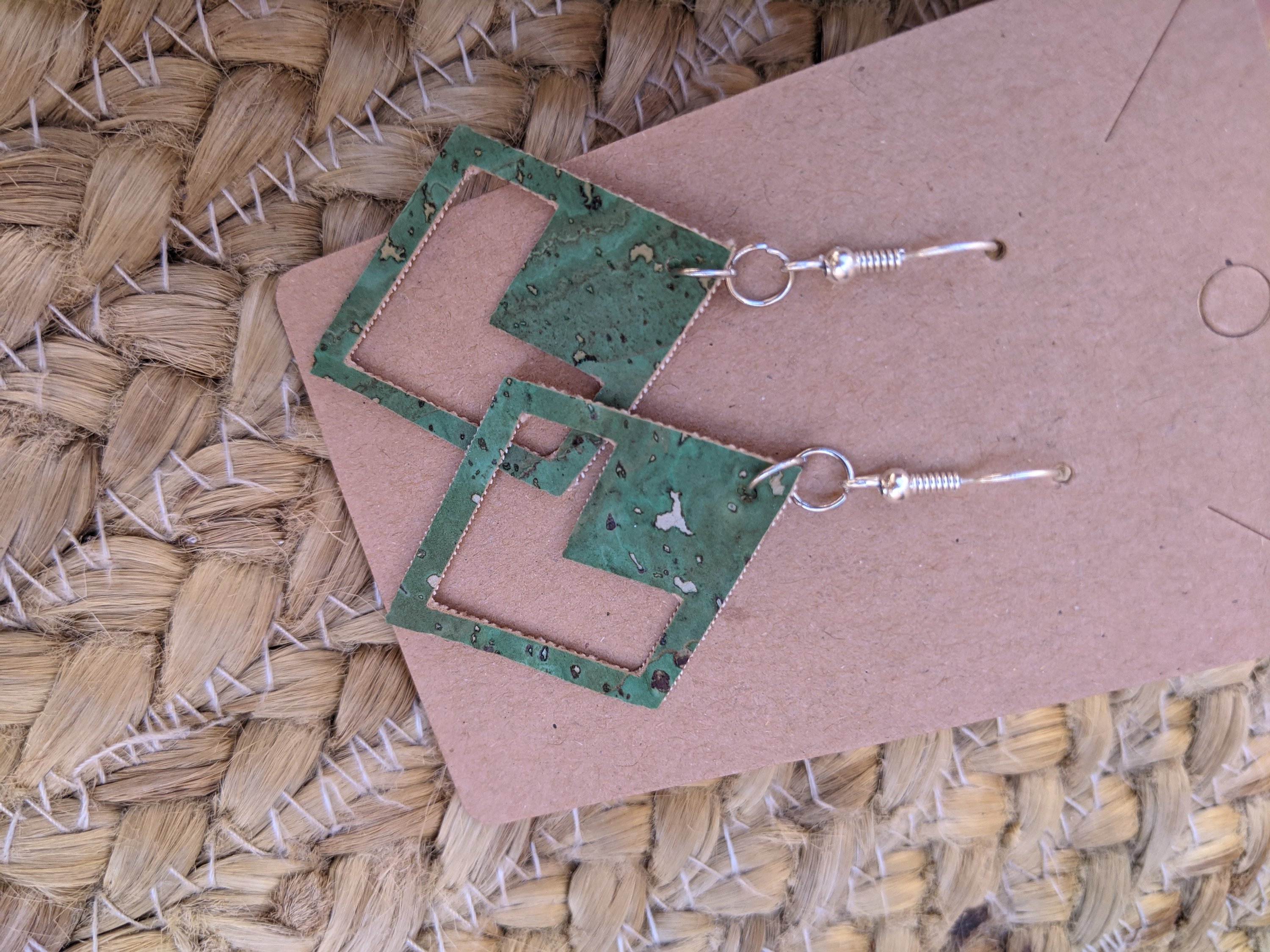 Handmade diamond shape green cork earrings, lightweight and eco-friendly, showcasing unique design.