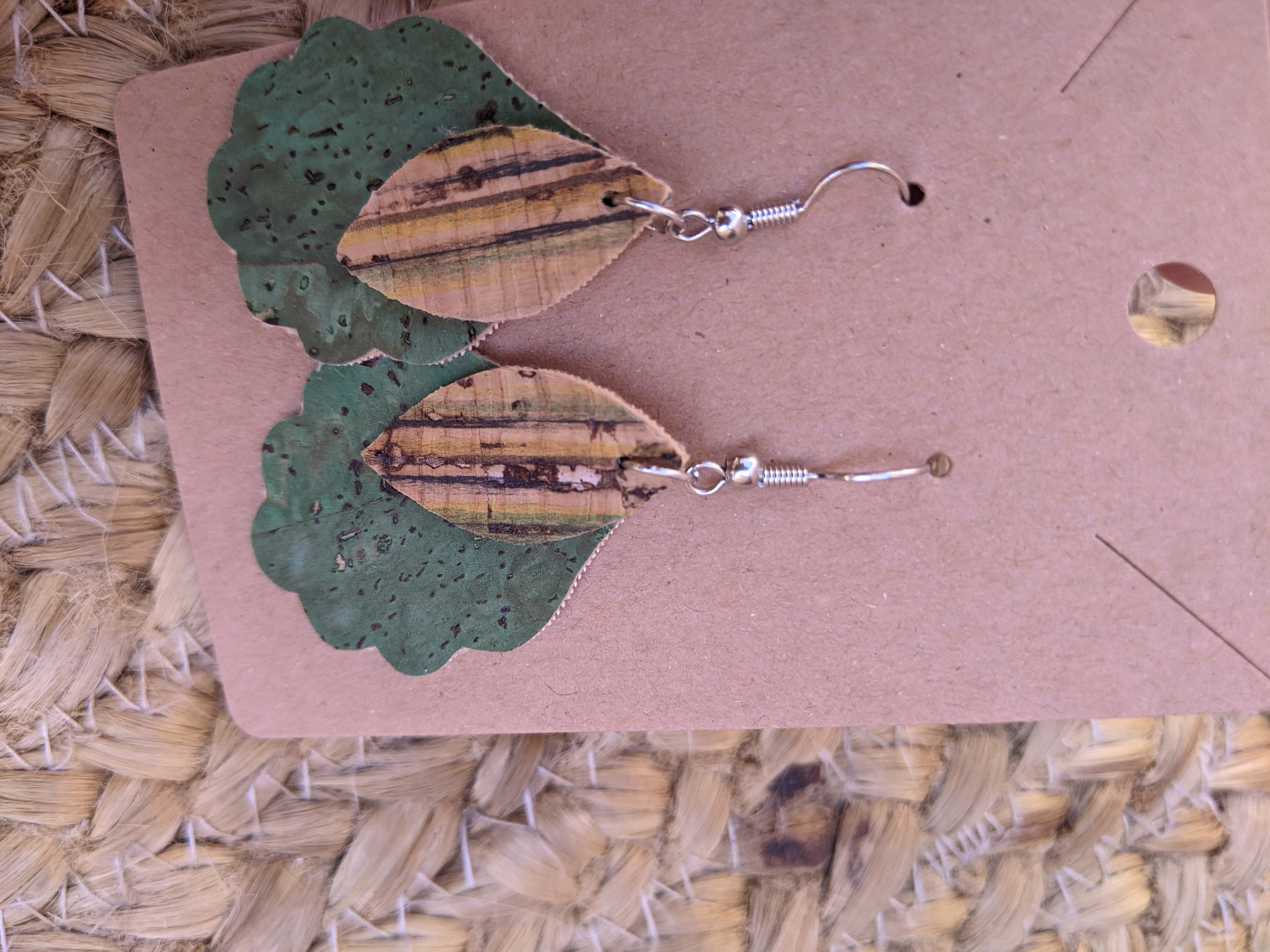 Handmade layered green and striped cork earrings, featuring a unique design with vibrant colors and lightweight construction.